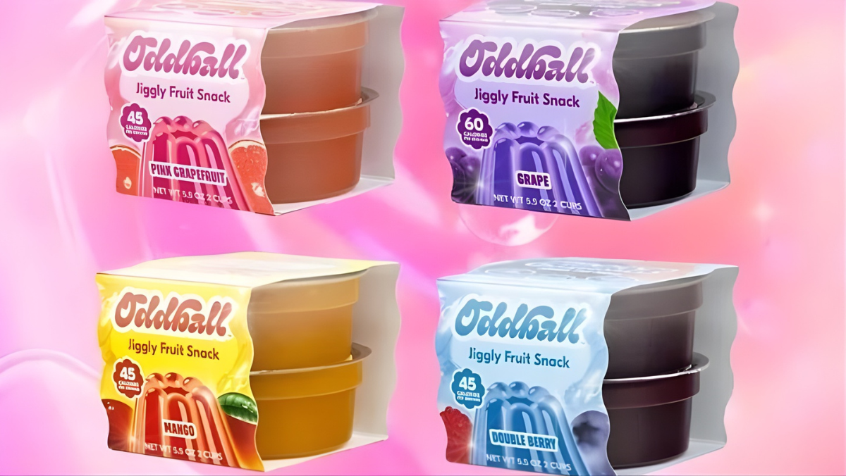 Assorted jiggly fruit snack cups in colorful packaging on a pink background