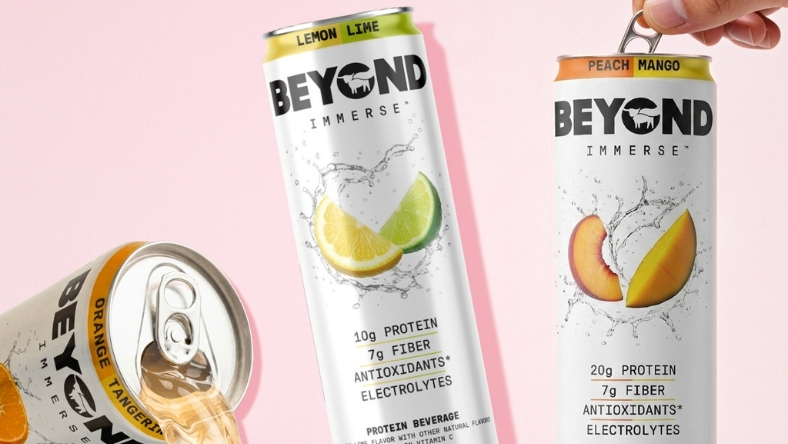 Cans of Beyond protein drinks in lemon lime and peach mango flavors